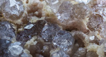 Grupo Mineralógico de Alicante.  Analcimas y Prehnita, Explotación de Ofitas. Sierra de Olta. Calpe. Alicante Alicante