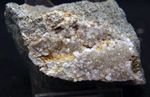 Grupo Mineralógico de Alicante.  Analcimas. Cantera  Barranco de la Mola. Sierra de Olta, Calpe. Alicante 